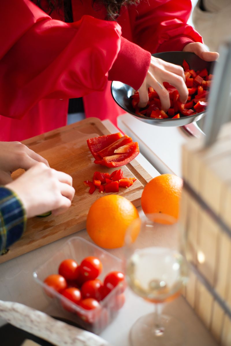 A bright, inviting kitchen filled with fresh fruits and vegetables, emphasizing a healthy raw food l