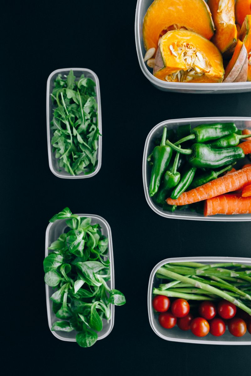 A vibrant, welcoming kitchen filled with reusable containers, fresh produce, and a compost bin, natu
