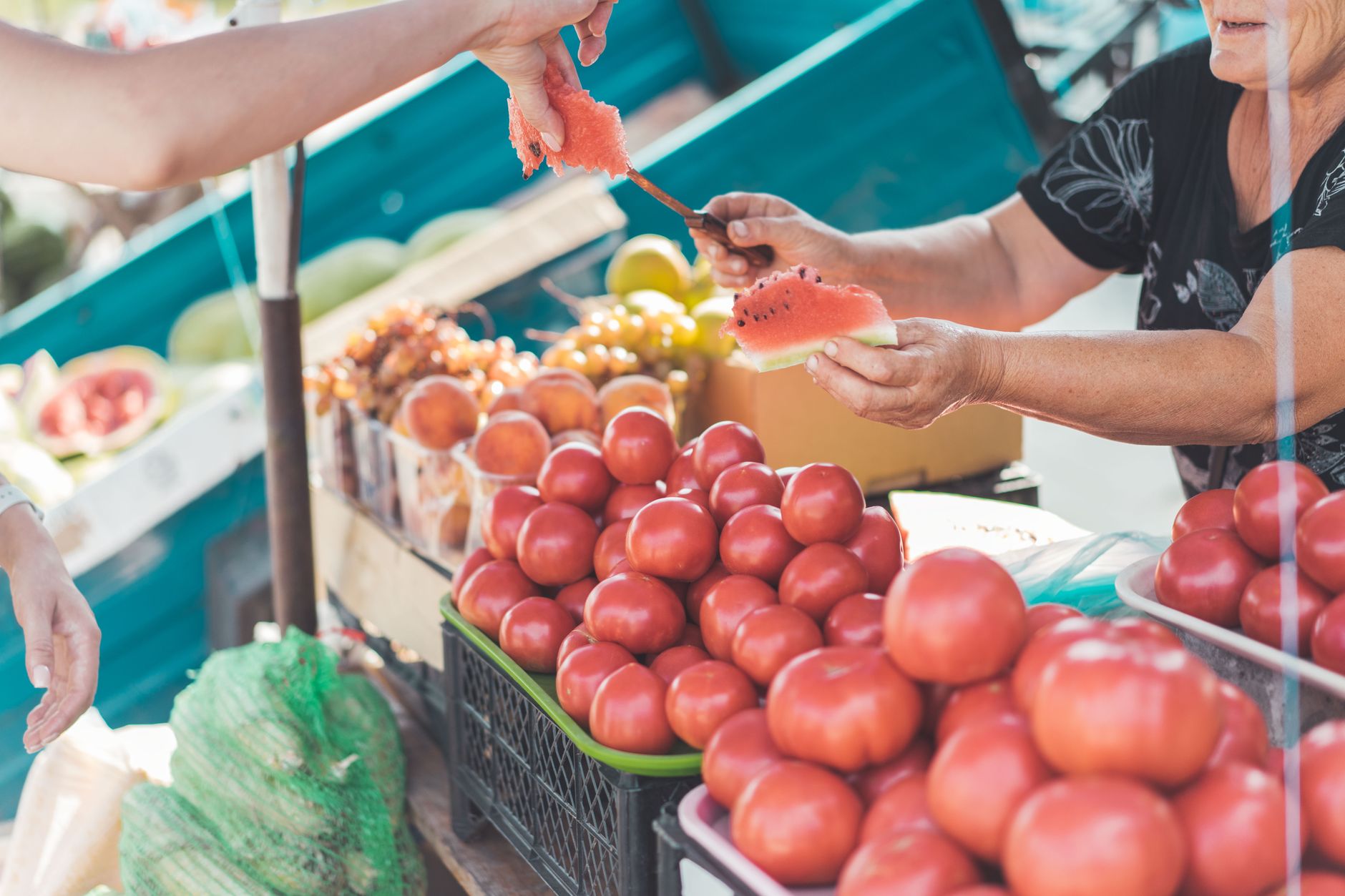 A vibrant farmer's market scene, showcasing colorful, fresh produce, with people engaging joyfully, sunlight filtering through leaves, warm and inviting atmosphere, capturing the essence of community and sustainability.
